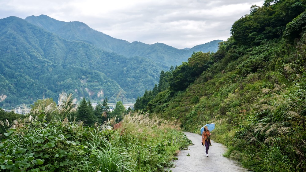 That Backpacker Walking Towards Fudo Falls On A Rainy Day In Fuzawa, Japan