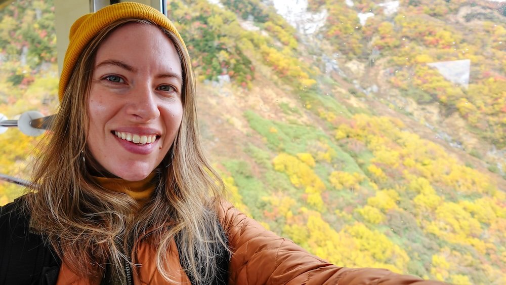 That Backpacker loving taking the cable car and enjoying the autumn colors on the Tateyama Kurobe Alpine Route in Japan