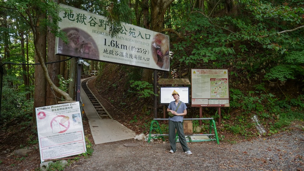 My Wife That Backpacker Standing Outside Of The Entrance Of Jigokudani Yaen-koen Monkey Park in Nagano, Japan