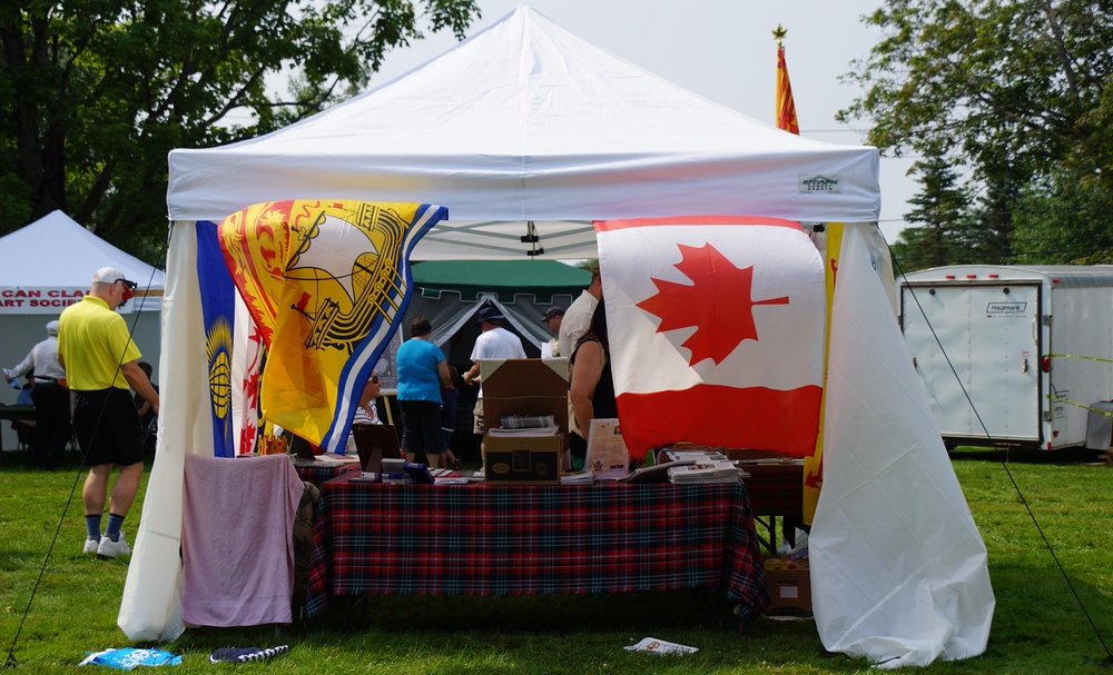 The New Brunswick Provincial flag and the Canadian National Flag at the Fredericton Highland Games 