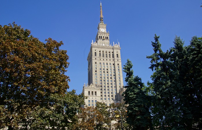 The Palace of Culture and Science framed by trees in Warsaw, Poland – Pałac Kultury i Nauki