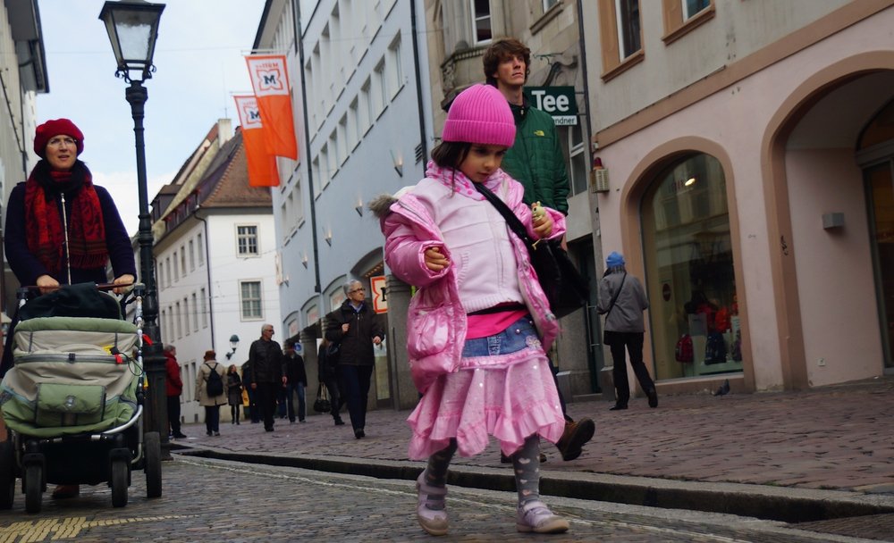 This cute little girl was decked out all in pink in a street scene in Freiburg