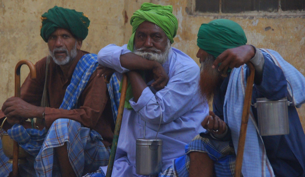 Three wise men sit down to share a conversation in Jaipur, Rajasthan, India