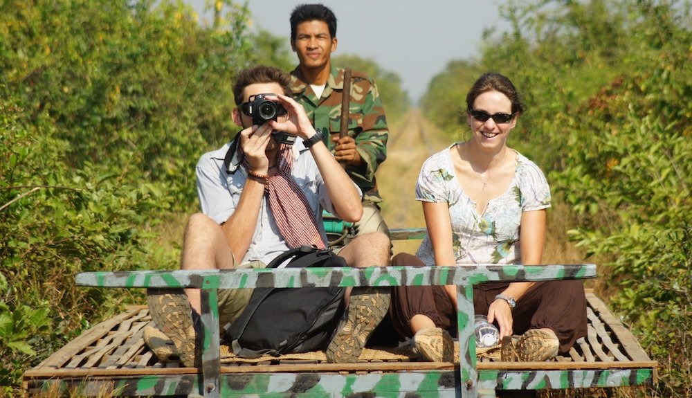 Tourists enjoying the bamboo train ride in Battambang, Cambodia 