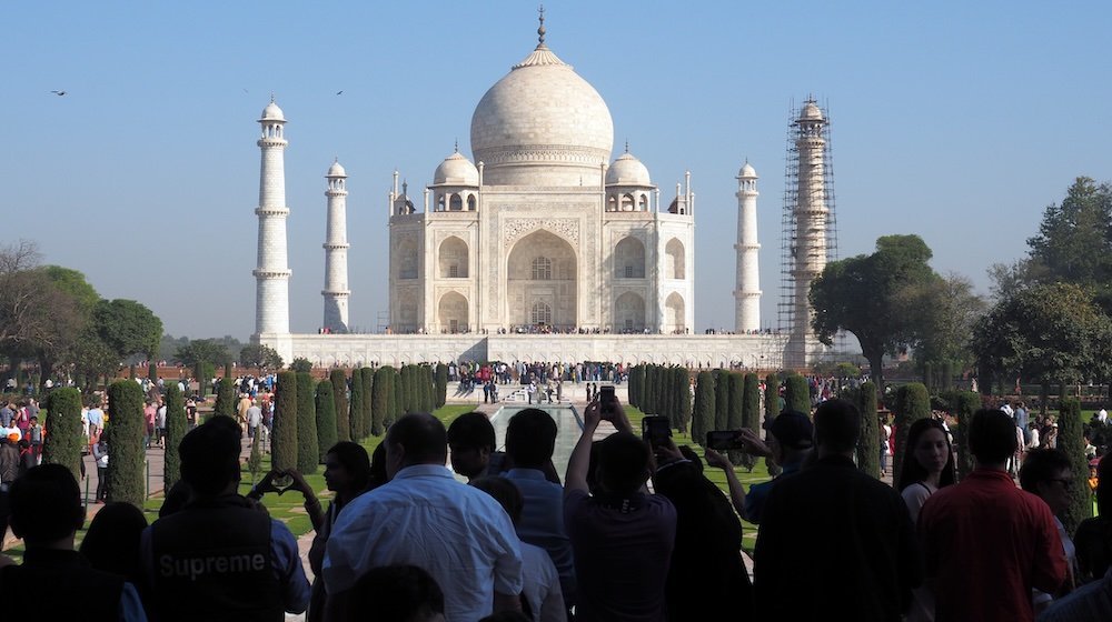 Tourists taking photos of the Taj Mahal in Agra, India