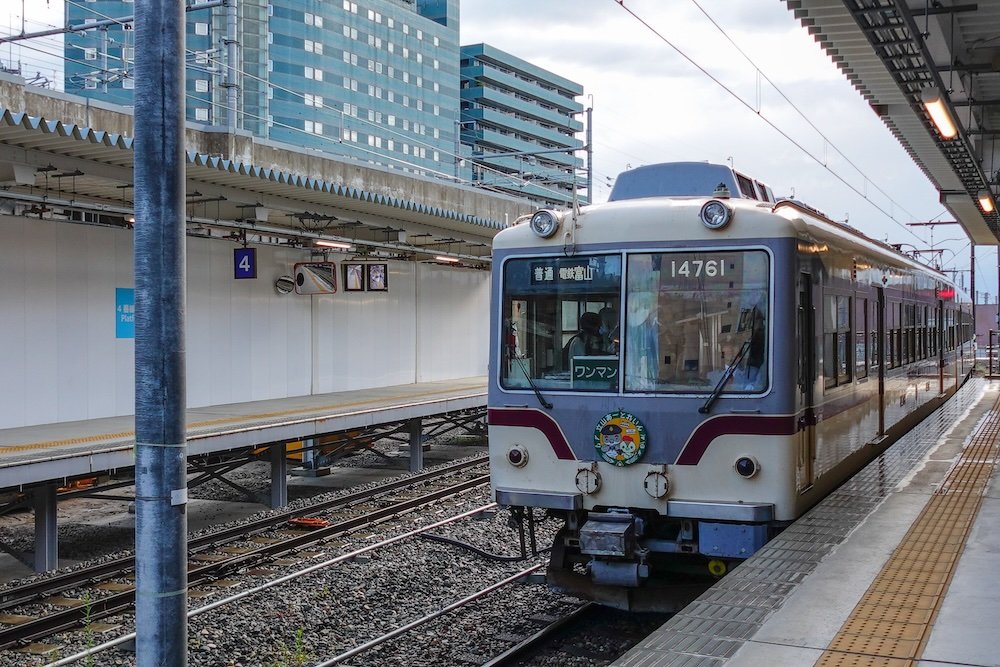 Toyama Chitetsu Railroad train parked outside of Dentetsu-Toyama Station along the Alpine Route in Japan 