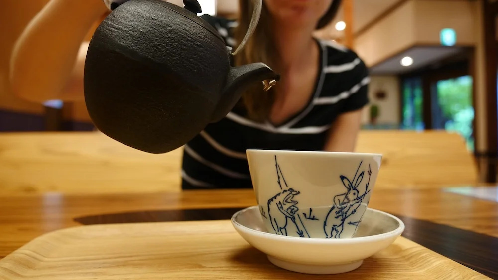 Traditional Japanese tea being poured into a cup in Takayama, Japan