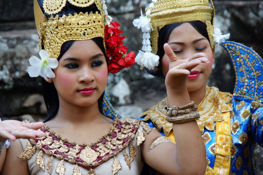 Traditional Khmer dances wearing elaborate costumes greet tourists at Bayon.