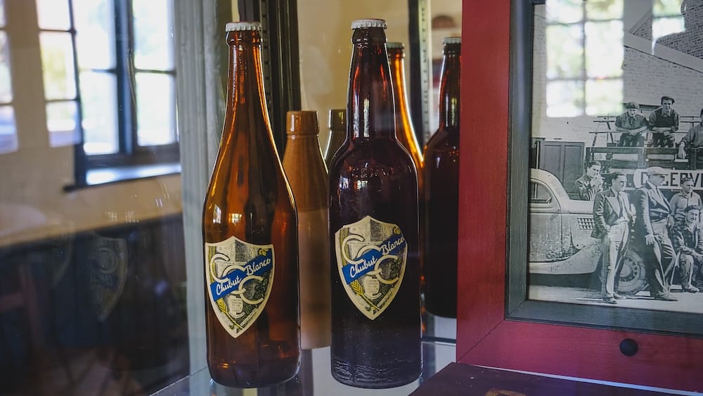 Vintage Chubut Blanco beer bottles displayed in Trelew, Patagonia, Argentina, highlighting the region’s deeper brewing heritage and historical beer culture beyond today’s modern craft brewery boom in southern Argentina.
