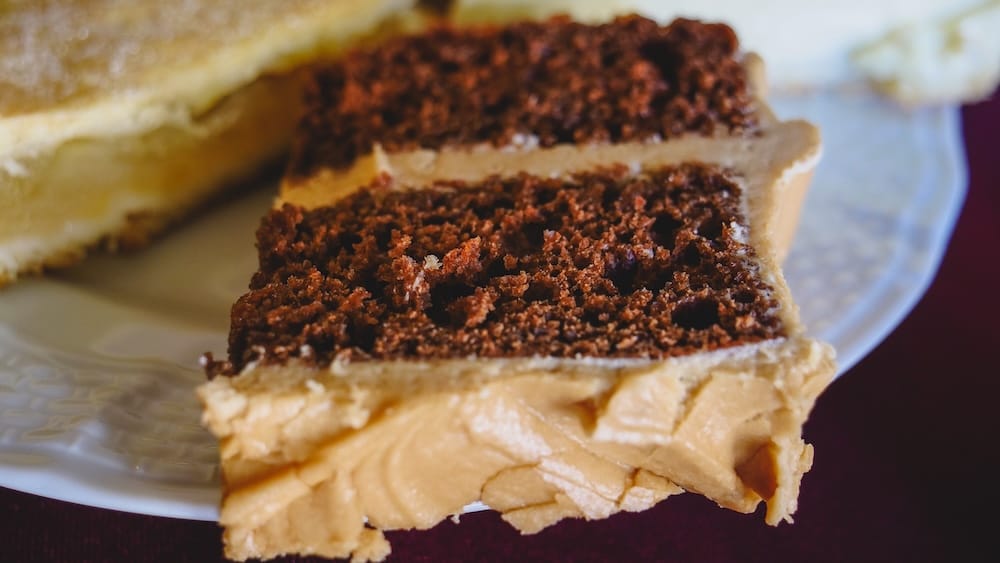 Trevelin Welsh tea cakes Nain Maggie Patagonia desserts chocolate sponge rich textures Argentina Close-up of dense cake and layered desserts served at Casa de Té Nain Maggie in Trevelin Patagonia Argentina, highlighting rich textures, chocolate sponge, and creamy toppings typical of mountain-influenced Welsh tea culture