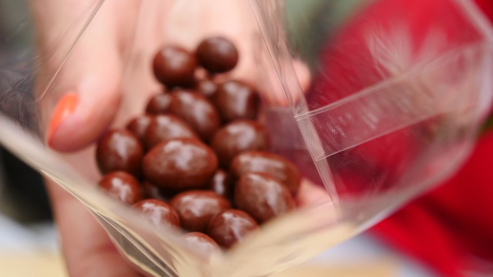 Try the Quirky "Deer Poop" Snack Chocolate-Covered Nuts this treat is simply delicious chocolate-covered nuts resembling deer droppings in Nara