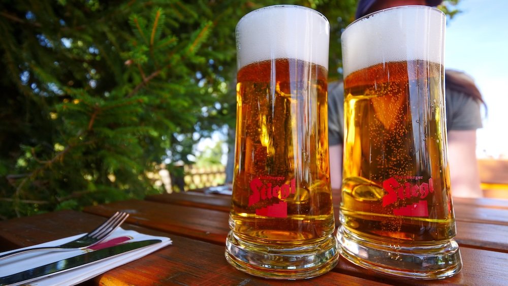 Two full pints of beer as a reward for reaching Gaisberg hiking day trip from Salzburg, Austria 