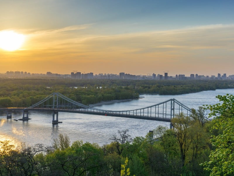 Kiev sunset views of the bridge and river and city off in the distance in Ukraine 