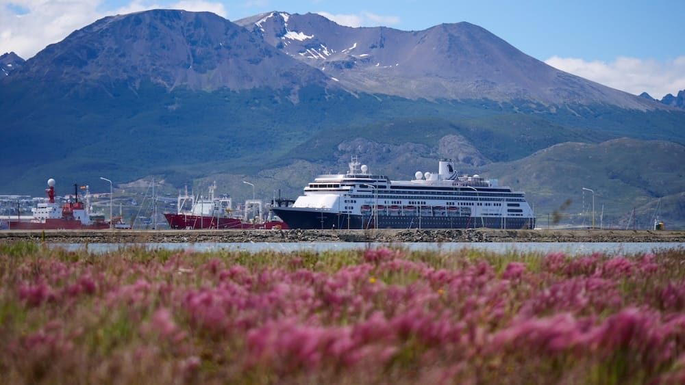 Ushuaia port Patagonia with cruise ship and mountains in Tierra del Fuego Argentina Cruise ship docked at Ushuaia port in Tierra del Fuego Patagonia Argentina with mountains in the background and coastal landscape highlighting the region’s role as a southern travel gateway