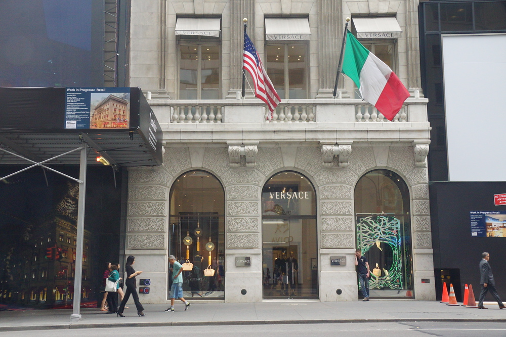 Versace store with American and Italian flags on Fifth Avenue in New York City