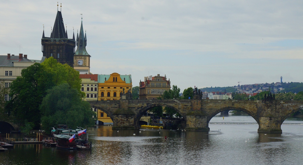 Views of the Vltava River with historic architecture and iconic bridge in Prague