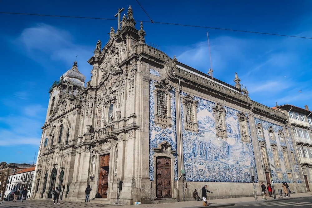 Visit the Blue Tiled Church Chapel of Souls Igreja do Carmo and Capela das Almas stuns with its azulejo-covered facade depicting saints and religious scenes in Porto, Portugal