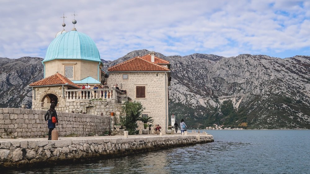 Visiting Our Lady of the Rocks Island Gospa od Skrpjela man-made island for the church and museum in Perast, Montenegro