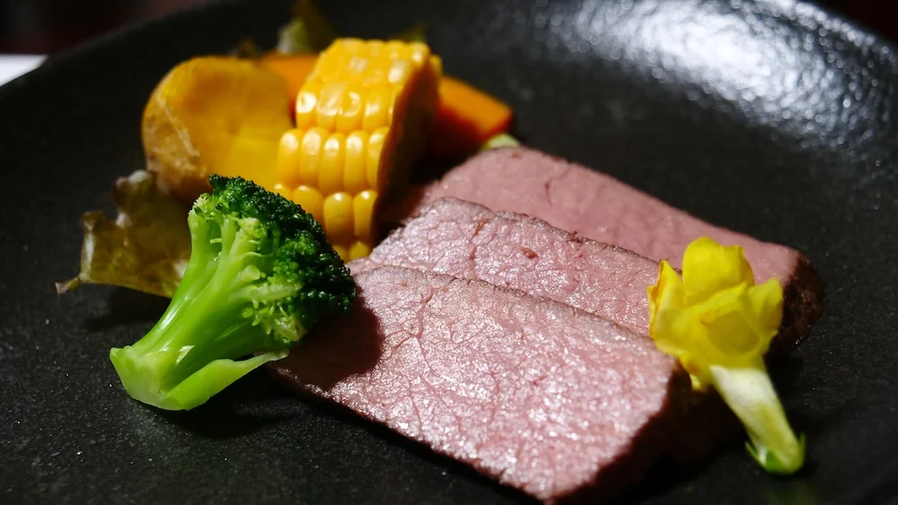 Wagyu beef with assorted vegetables as part of a Kaiseki Japanese food in Japan 