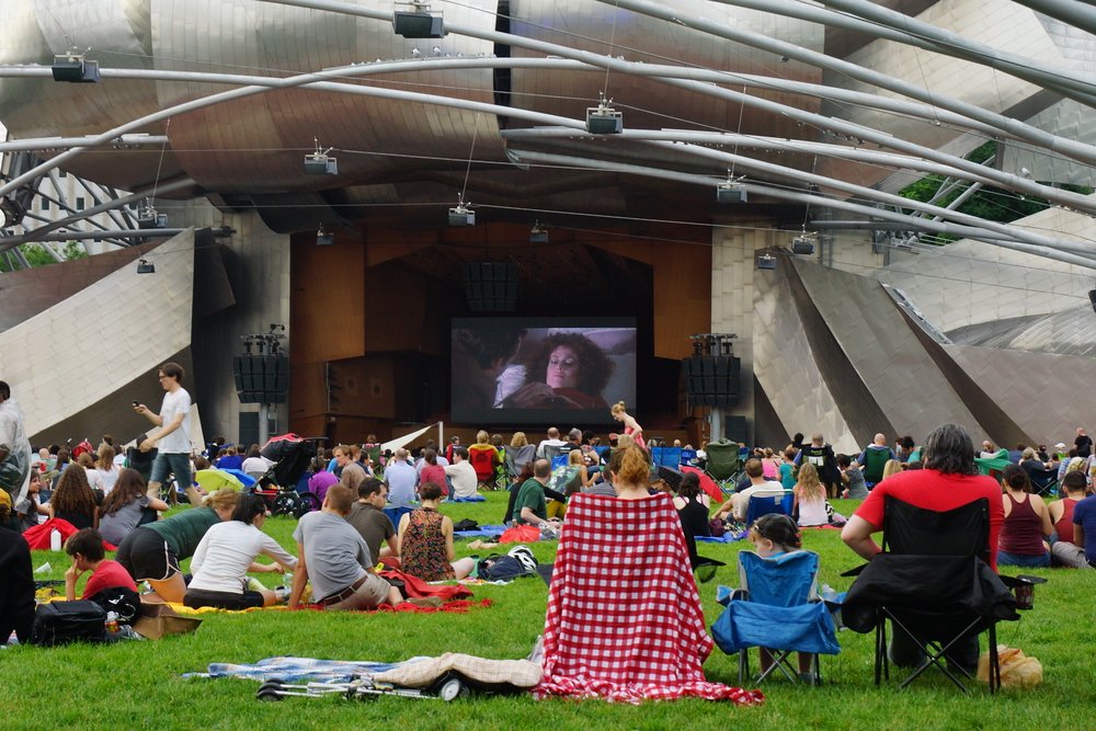 Watching a free movie outside at the Pavilion nearby Millennium Park as one of many free attractions in Chicago