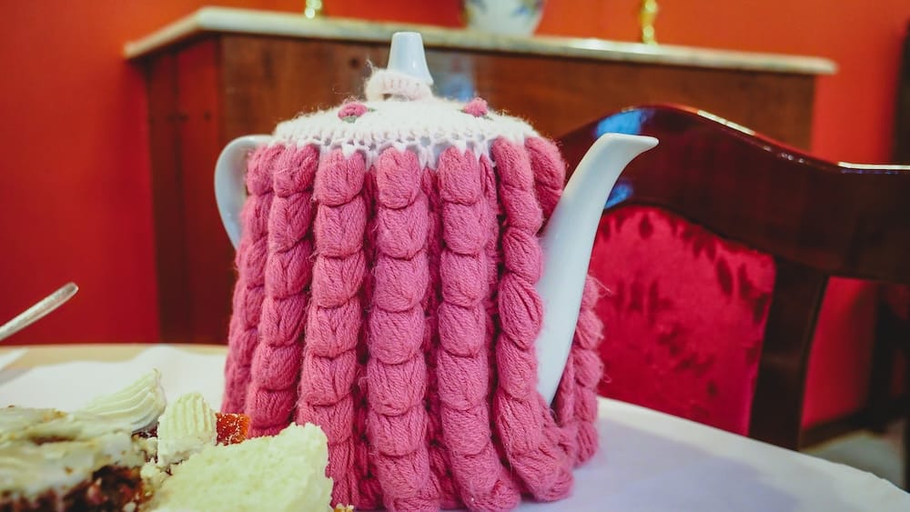 Welsh tea Ty Te Caerdydd Gaiman Patagonia teapot cozy cultural tradition Chubut Valley Argentina Welsh tea served in a teapot with knitted cozy at Ty Te Caerdydd in Gaiman Patagonia Argentina, representing the preserved tea tradition rooted in Welsh settlers survival, community, and cultural identity in the Chubut Valley