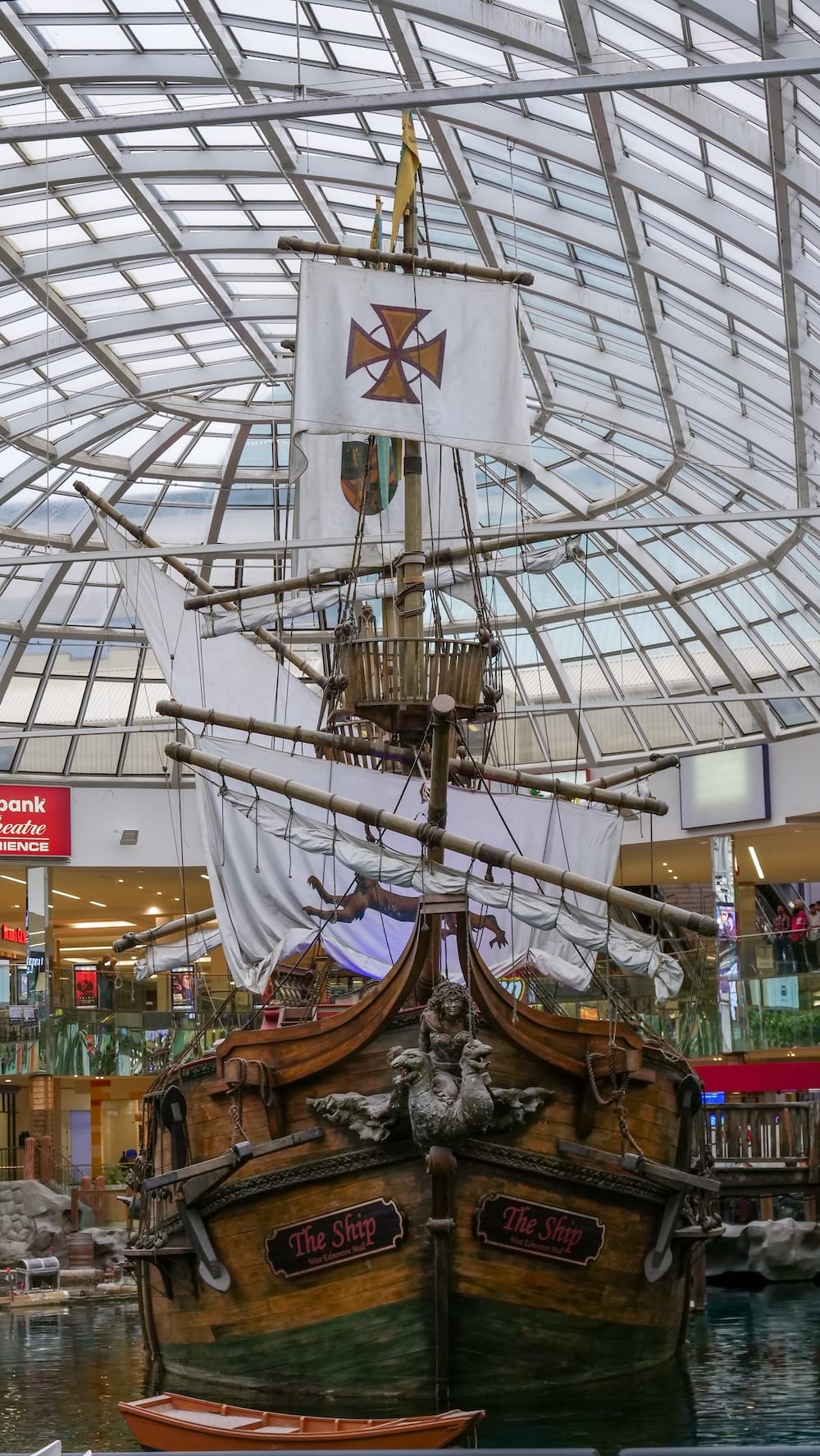 Pirate Ship Beneath the Glass Atrium at West Edmonton Mall Front view of the full-size replica pirate ship beneath the glass atrium roof inside West Edmonton Mall in Edmonton, Alberta, with its sails, rigging and carved wooden bow visible.