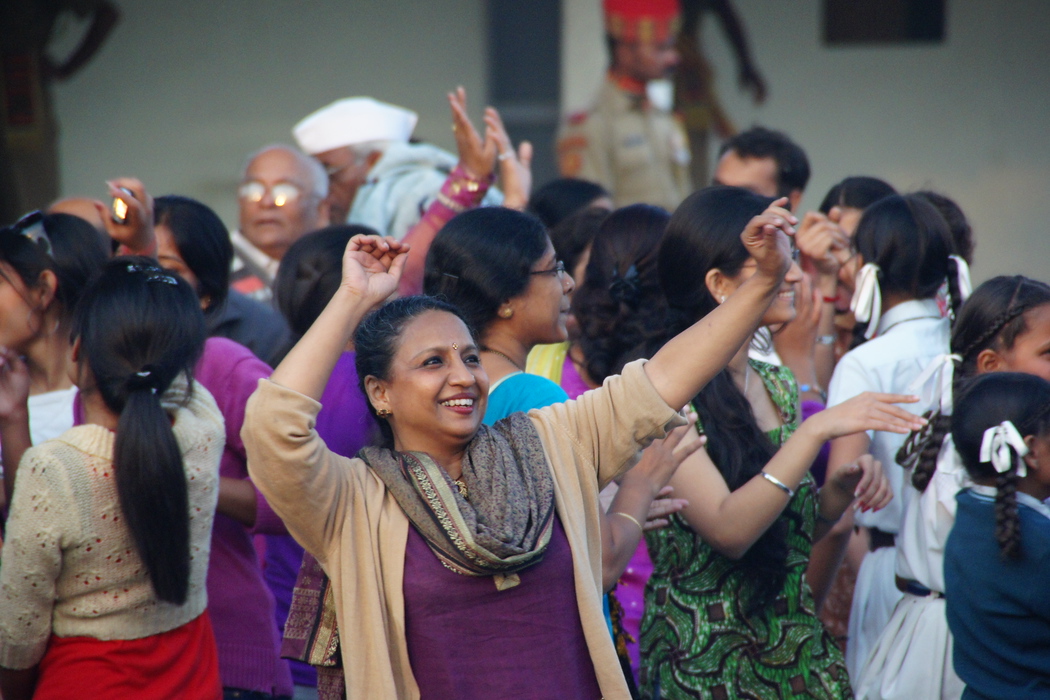 Woman dancing before the border closing ceremony started between India and Pakistan 