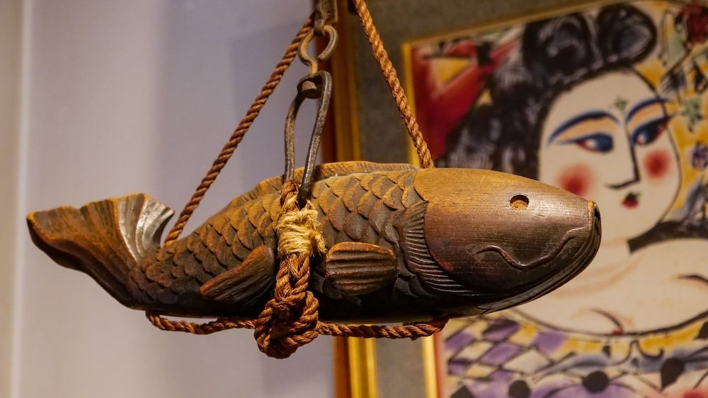 Wooden fish carving hanging in Kanazawa, Japan