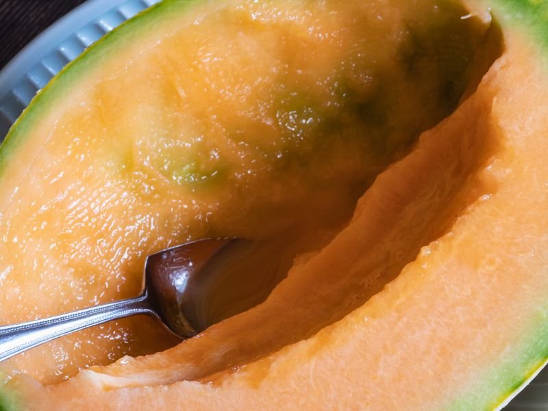 Yubari melon with spoon inside 